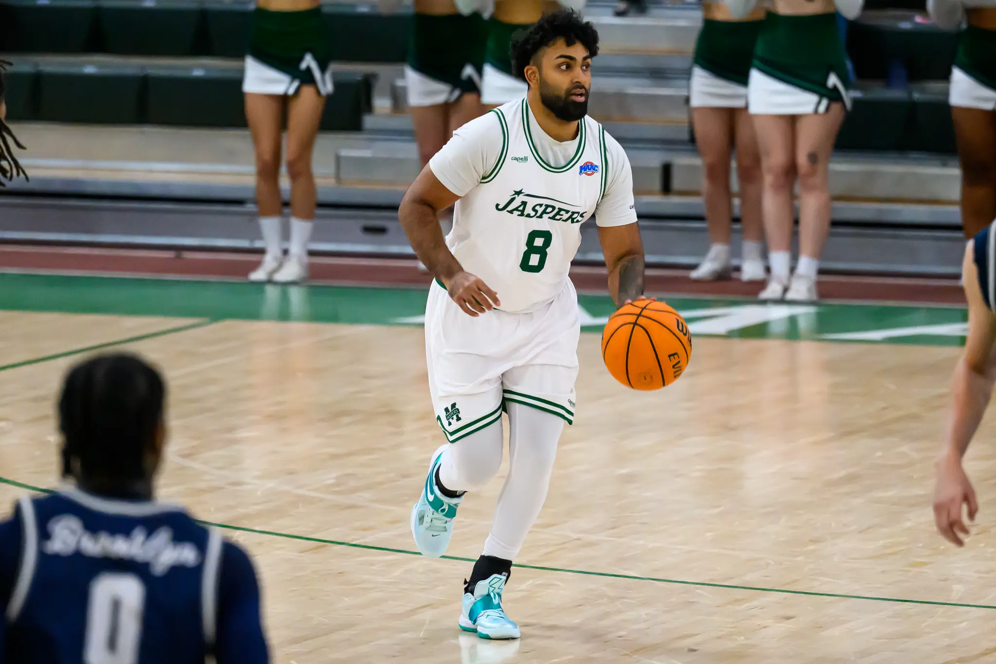 Aryan Arora dribbling at Manhattan University