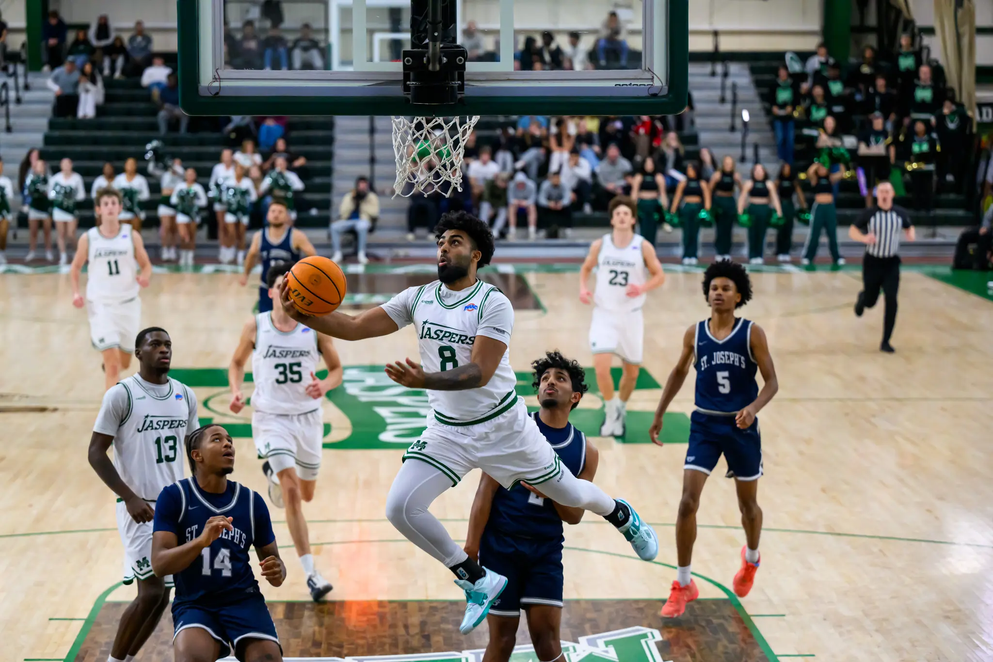 Aryan Arora driving to the basket